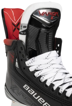 Bauer Vapor X5 Pro Senior Hockey Skates 13 Bauer Vapor X5 Pro Senior Hockey Skates -Hockey Equipment Store 1061681 BTH23 SKATE VAPOR X5PRO SR tongue detail edit ce05c9ed 3e31 4c9f bc36 e2487c7fe019